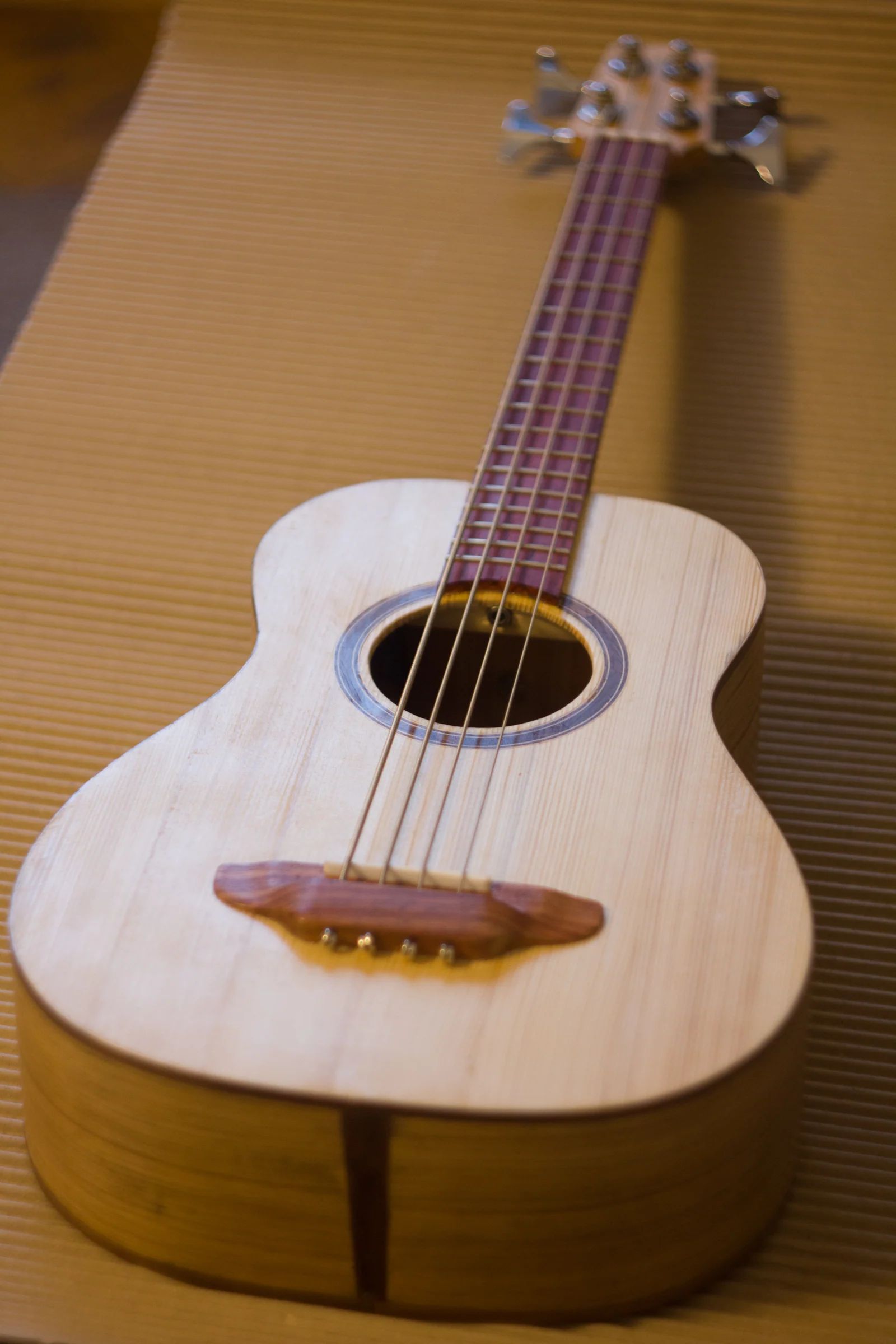 Handmade acoustic uke-bass photographed from above