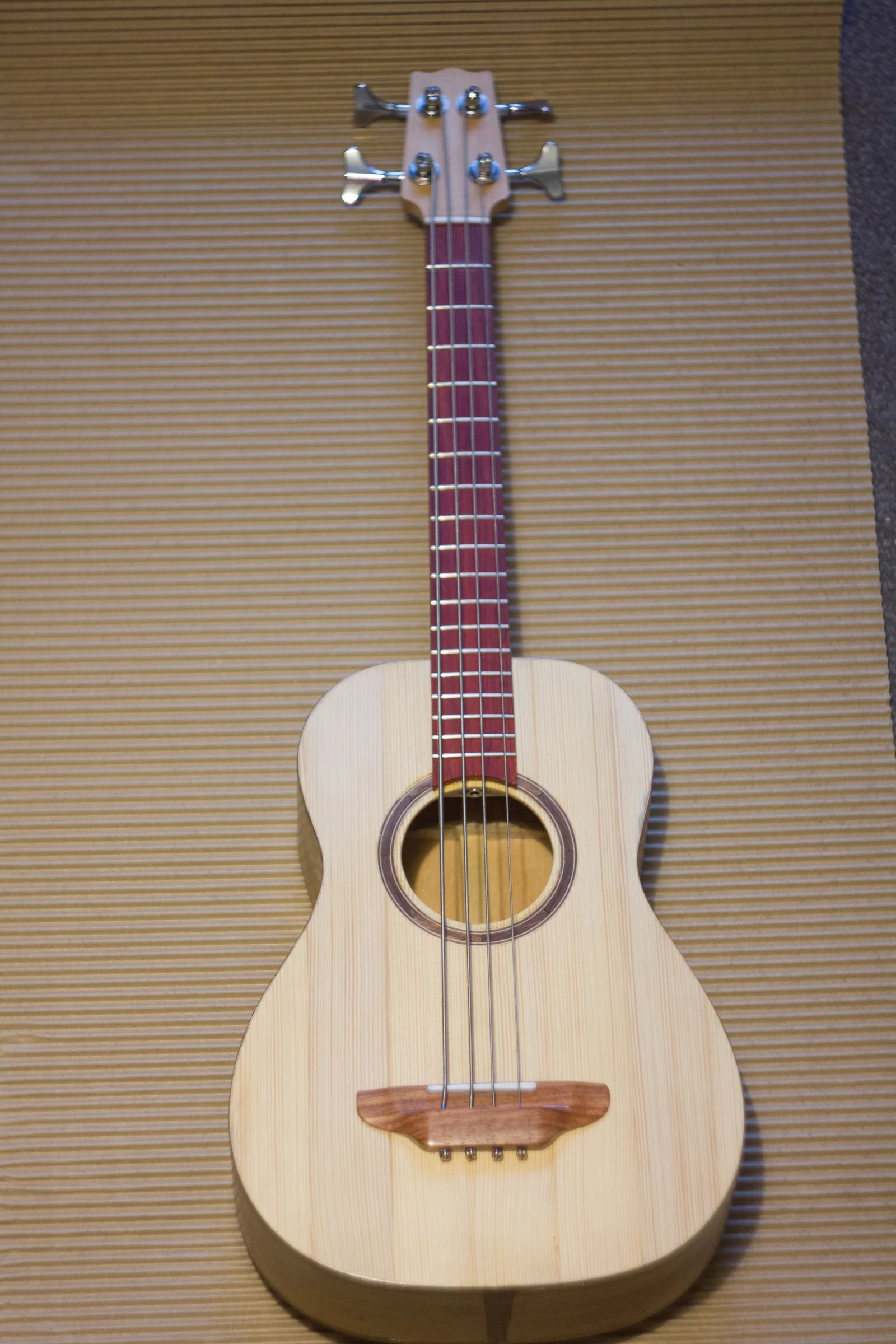Front view of the handmade acoustic uke-bass