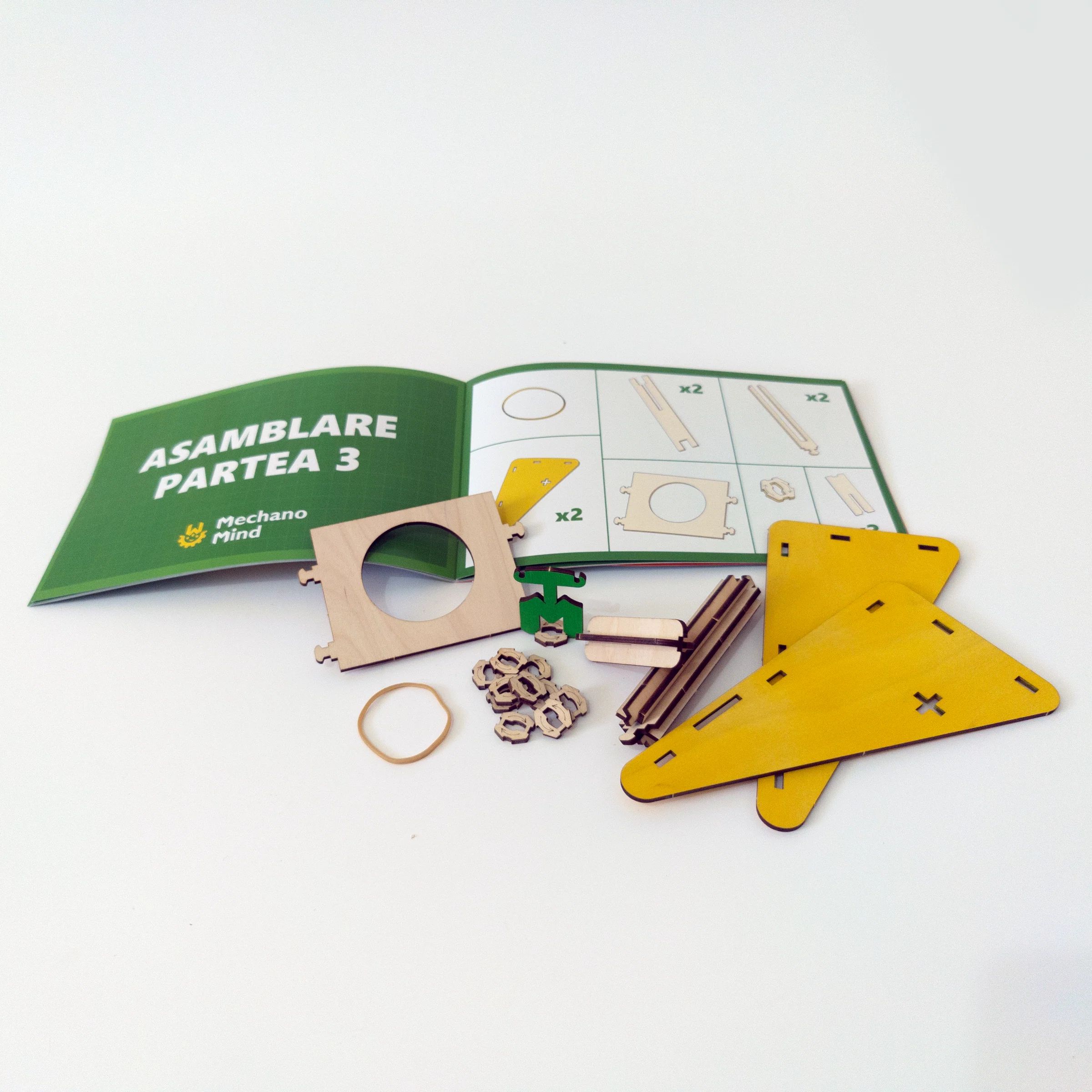 Disk launcher components arranged with their illustrated assembly manual