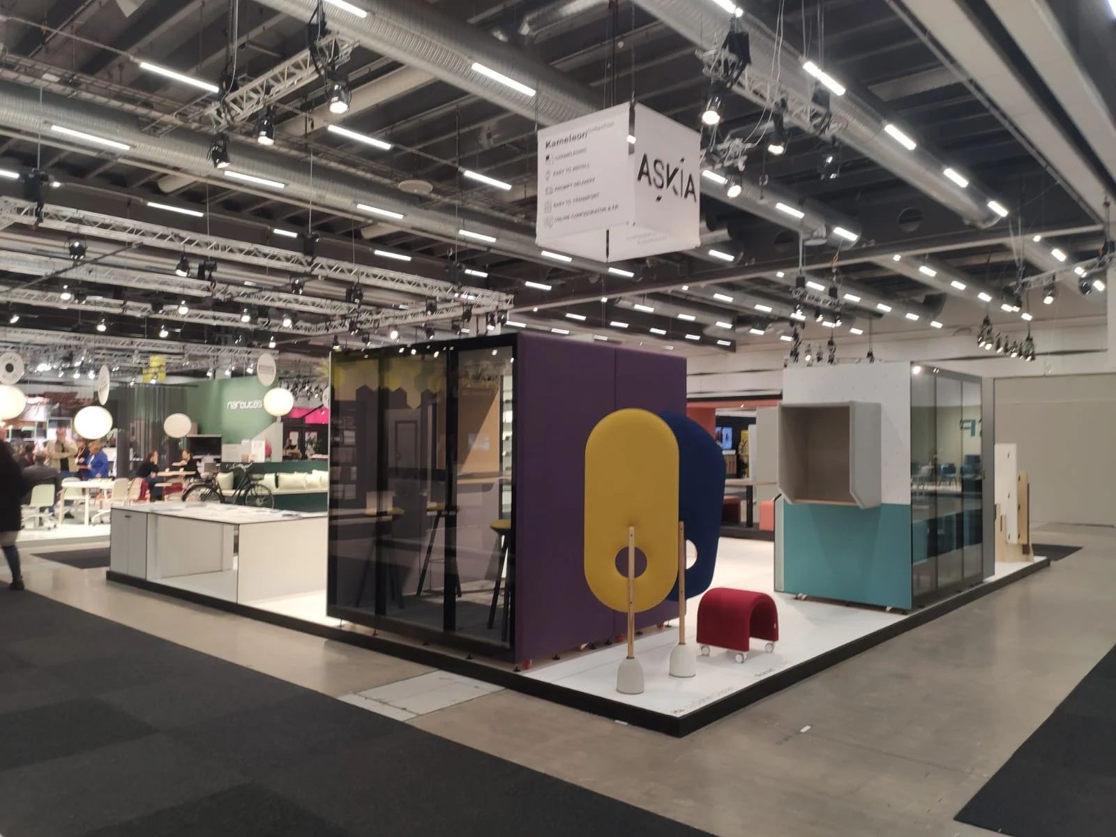 Askia Furniture exhibition stand with a white modular floor