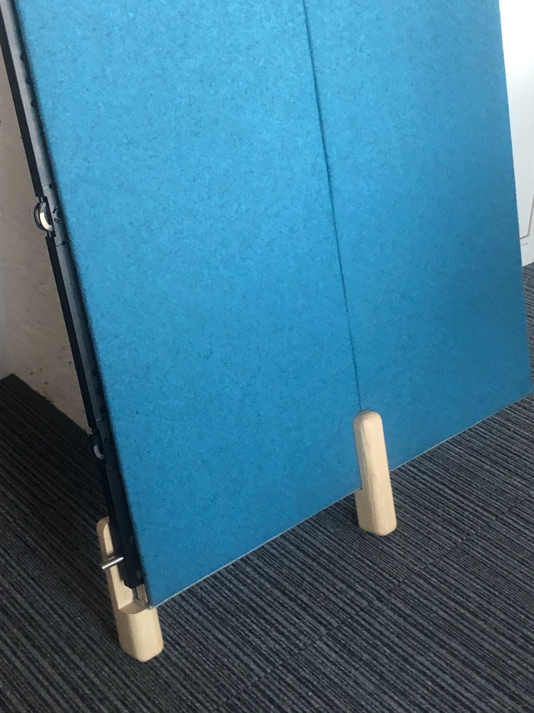 Installed prototype detail showing the concealed joint between two blue acoustic panels