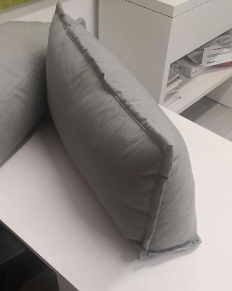 Grey upholstered prototype shown from the side