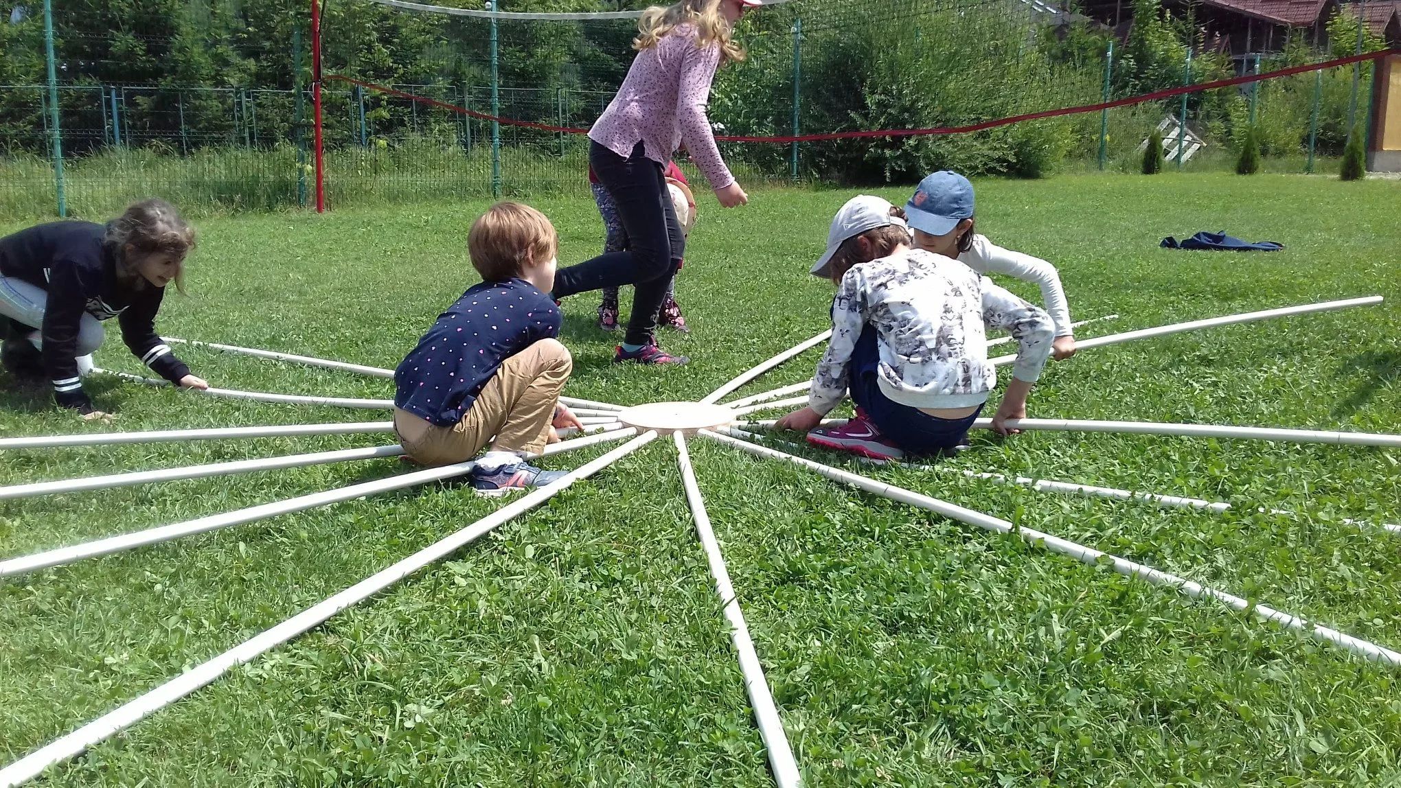 Camp participants assembling the dome frame together
