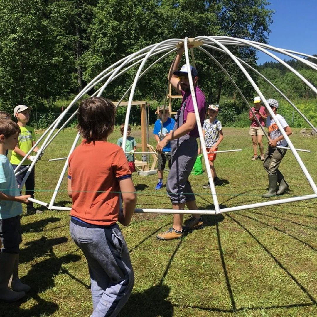 Umbrella dome activity in progress at summer camp